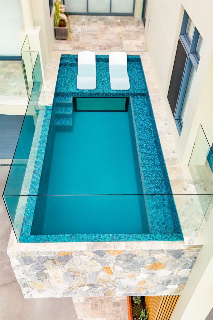 First floor pool with glass viewing window by Cloud 9 Pools